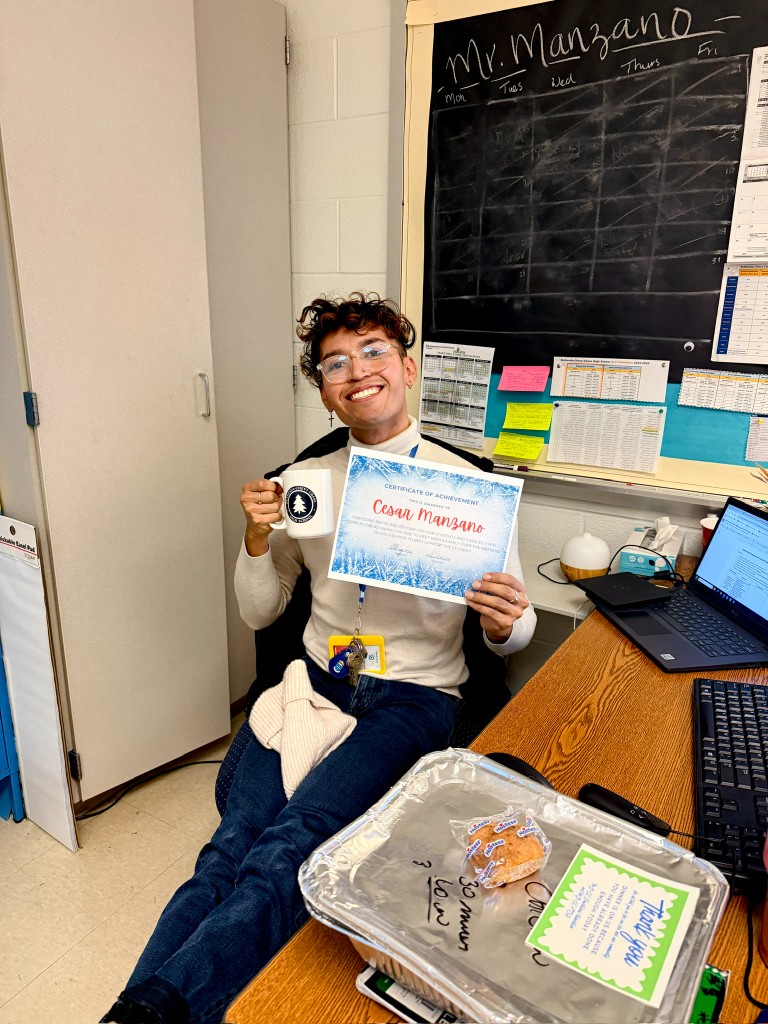 Educator holding certificate for family engagement